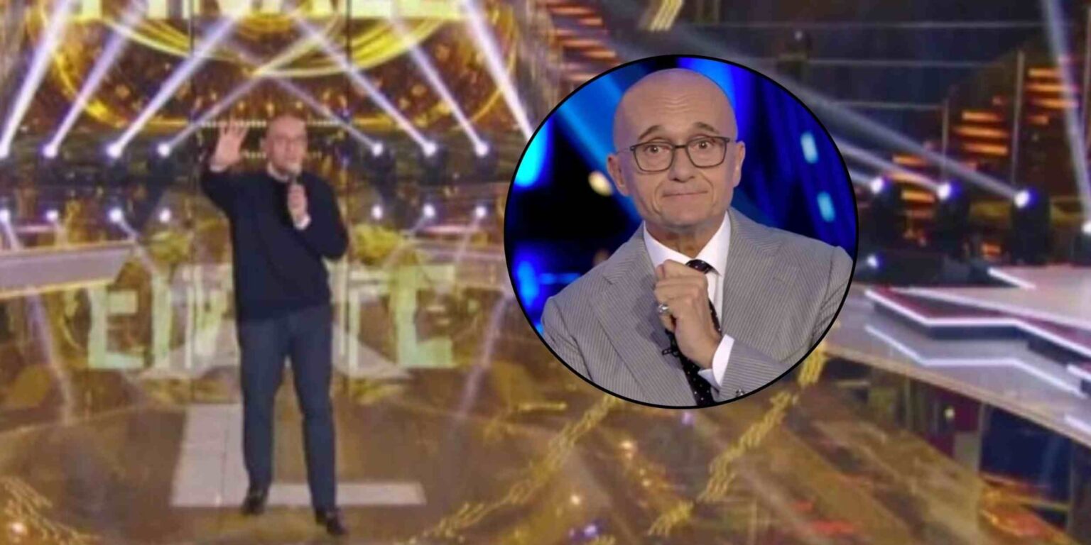 Studio del GF Vip con luci accese e grafica del programma, mentre circolano i nomi per sostituire Alfonso Signorini alla conduzione.
